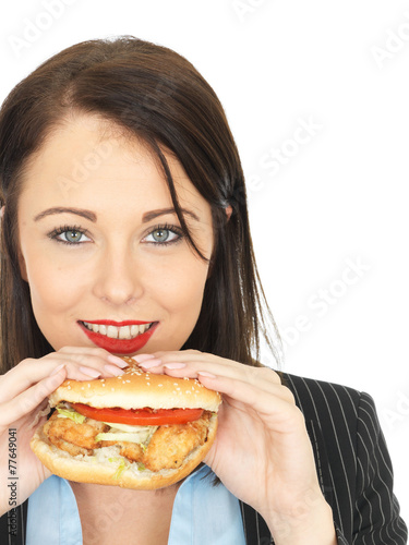 Young Business Woman Eating a Chicken Burger
