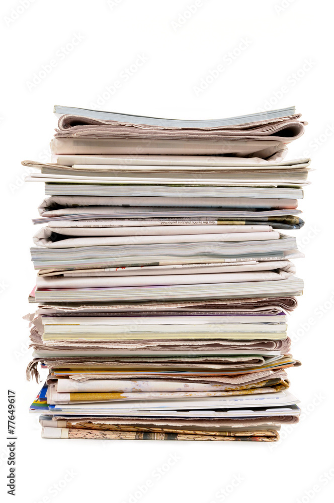 Stack of old newspapers and magazines tall vertical isolated on white background photo Stack of old newspapers and magazines tall vertical isolated on white background photo