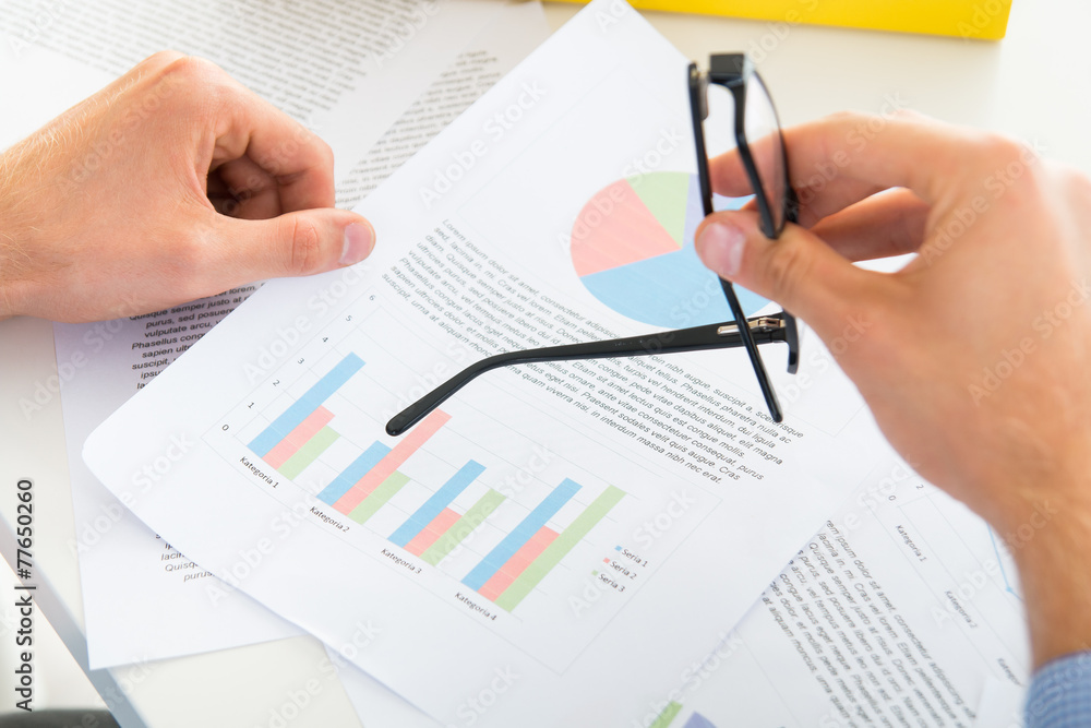 Man pointing with glasses his document Man pointing with glasses his document