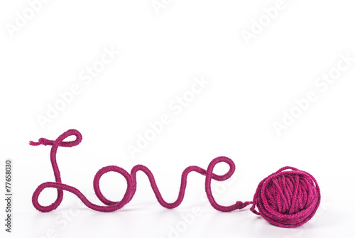 word love of red thread on white background