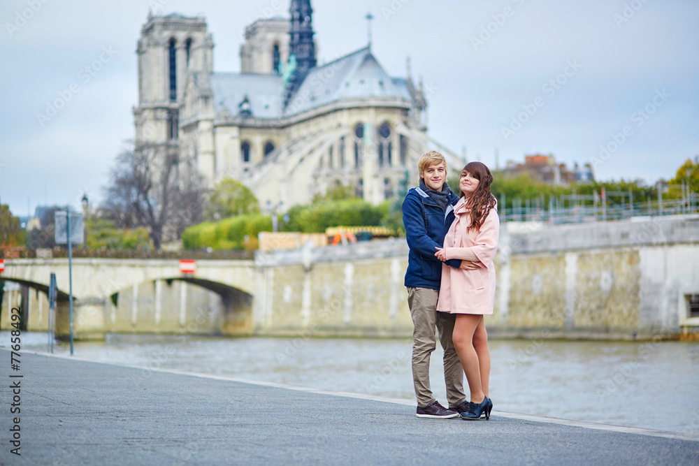 Young dating couple on the Seine embankment
