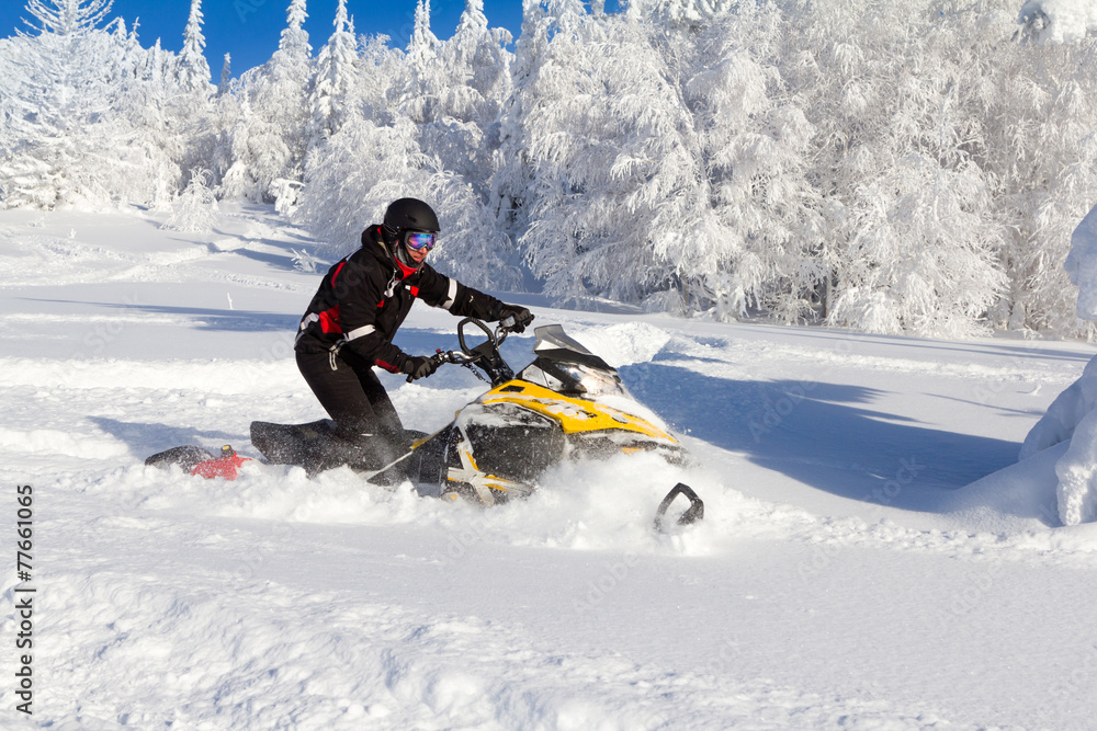 Athlete on a snowmobile