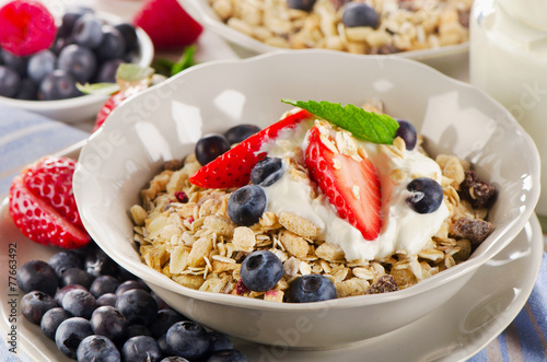 Healthy Breakfast with berries, yogurt , muesli.