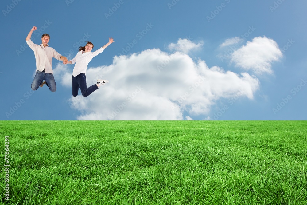 Composite image of couple jumping and holding hands Composite image of couple jumping and holding hands