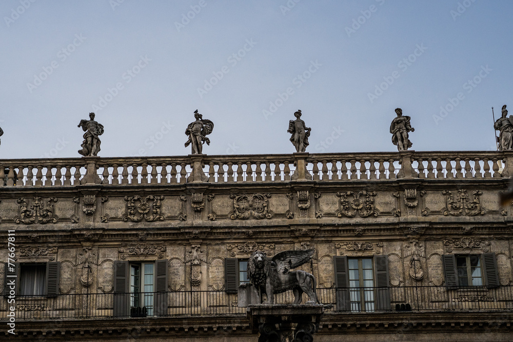 Human Statue on Top of Architectural Old Building