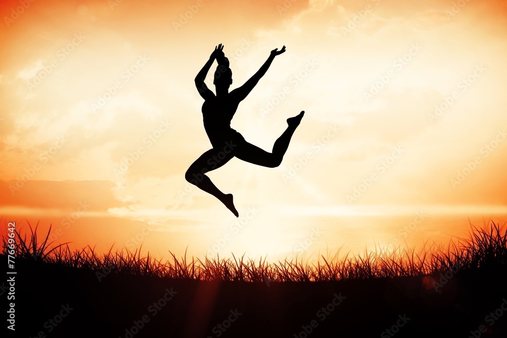 Composite image of fit brunette jumping and posing Composite image of fit brunette jumping and posing
