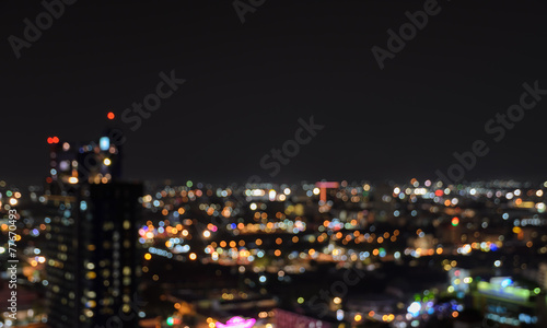 Blurred city lights bokeh illuminated at night