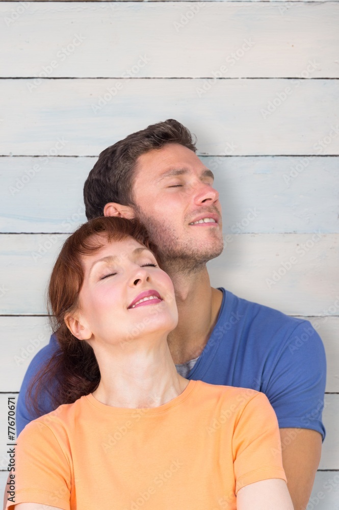 Fototapeta premium Composite image of happy couple together looking upwards