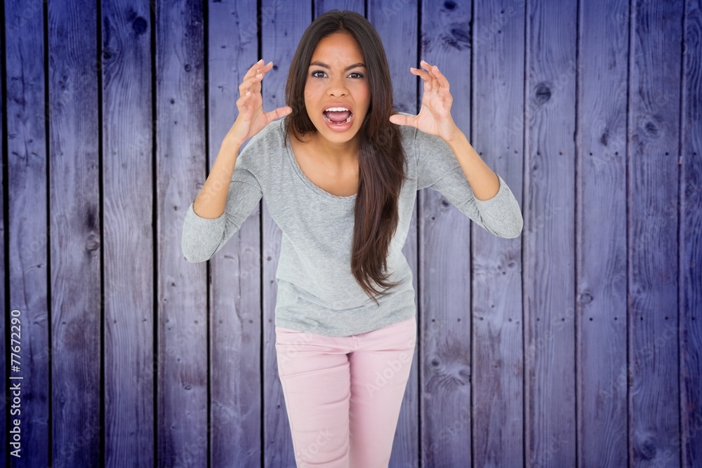 Composite image of angry brunette shouting Composite image of angry brunette shouting
