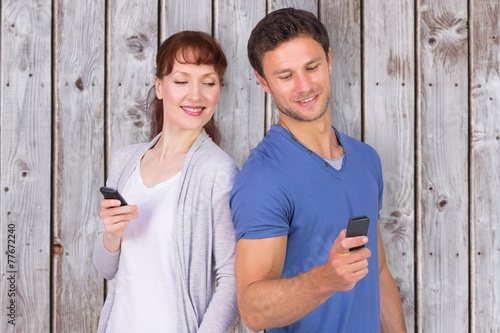 Composite image of couple both making phone calls