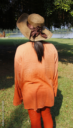 women wear orange clothing at nature photo