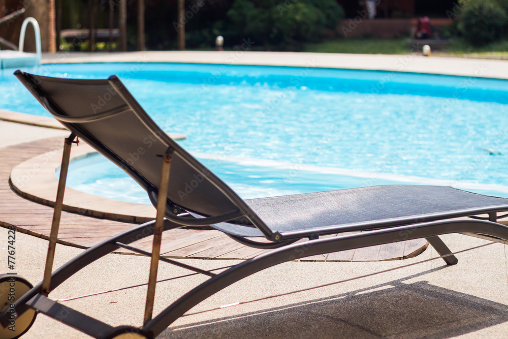 Swimming pool with beach chairs