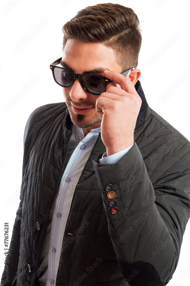 Business man wearing casual elegant holding his sunglasses Business man wearing casual elegant holding his sunglasses
