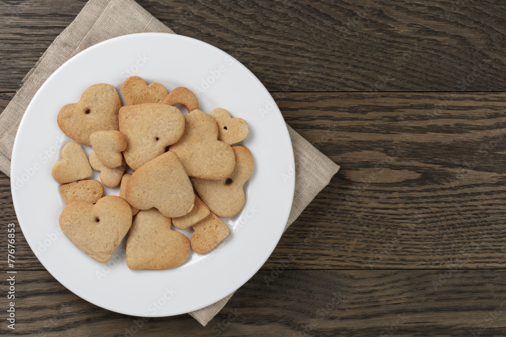heart cookies for valentines day in plate on wood table heart cookies for valentines day in plate on wood table