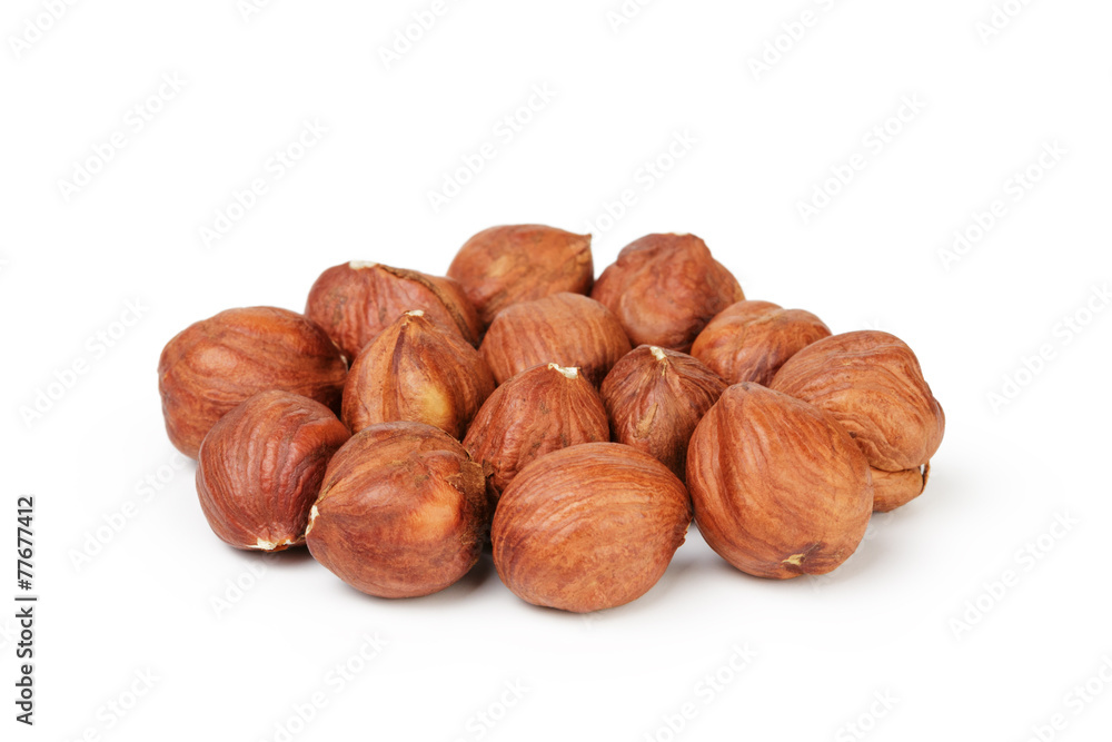 Heap of peeled hazelnuts isolated on white Heap of peeled hazelnuts isolated on white