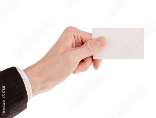 Businessman in suit holding a blank business card isolated