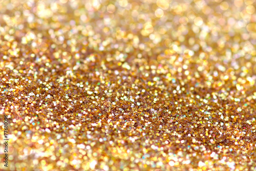 Gold nuggets sparkling carpet. Close-up view, very shallow deep