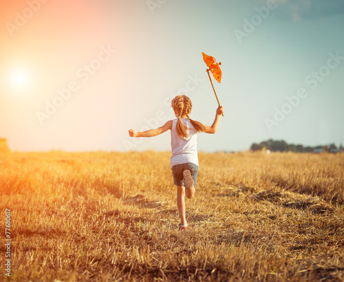 cute little girl with a windmill