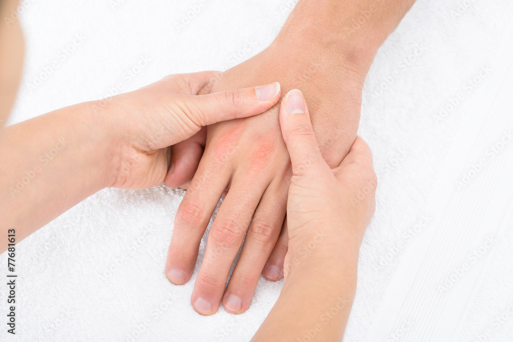 Physiotherapist Massaging Palm