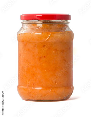 squash puree in a glass jar on a white