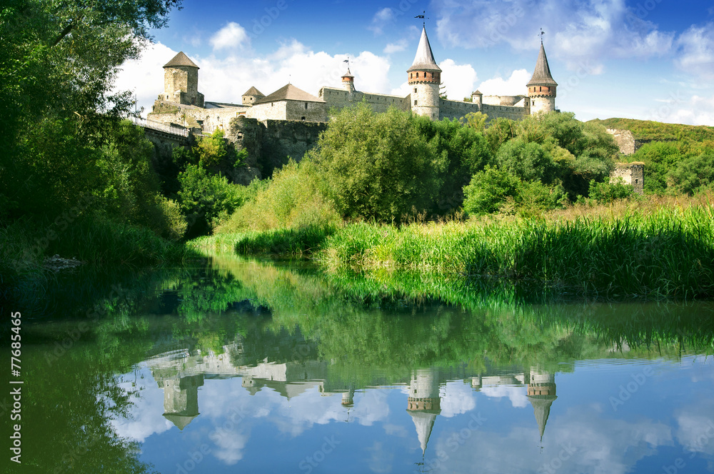 Castle on the hill and its reflection in water Castle on the hill and its reflection in water