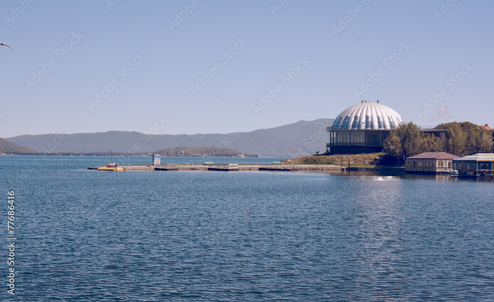 Obraz premium Sevan lake with houses, buildings and mountains