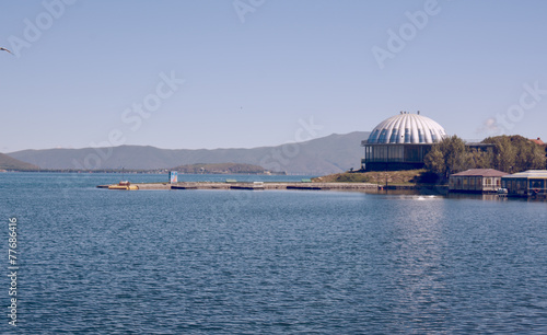 Sevan lake with houses, buildings and mountains