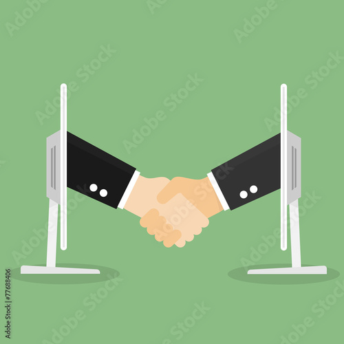 Partnership handshake to business success Online via computer