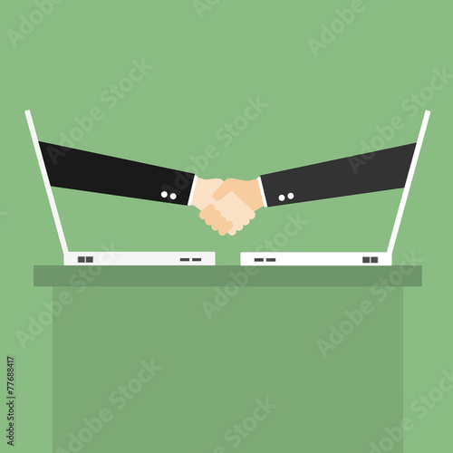 Partnership handshake to business success Online via laptop