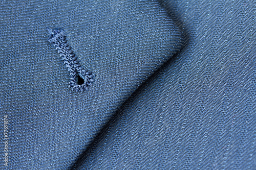 Close up detail of buttonhole on suit lapel photo