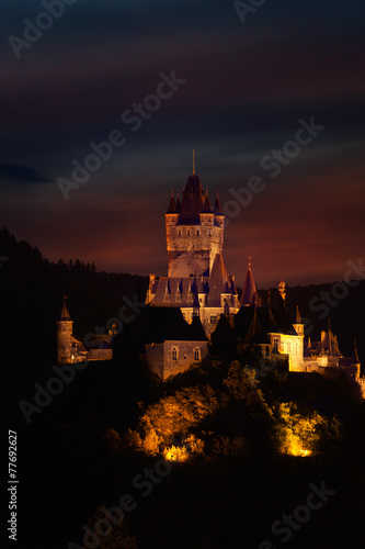 View of Cochem castle at the evening over dark sky