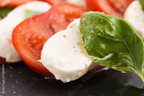 Caprese salad with mozzarella, tomato, basil and balsamic vinega