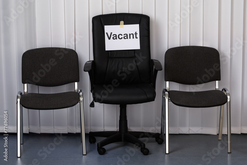 Office Chair With A Vacant Sign