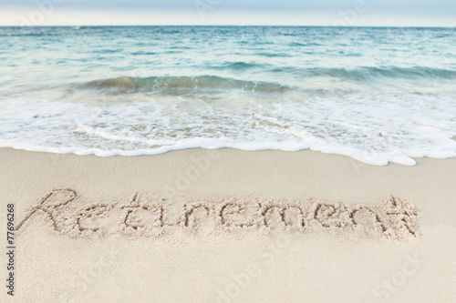 Retirement Written On Sand By Sea © Andrey Popov