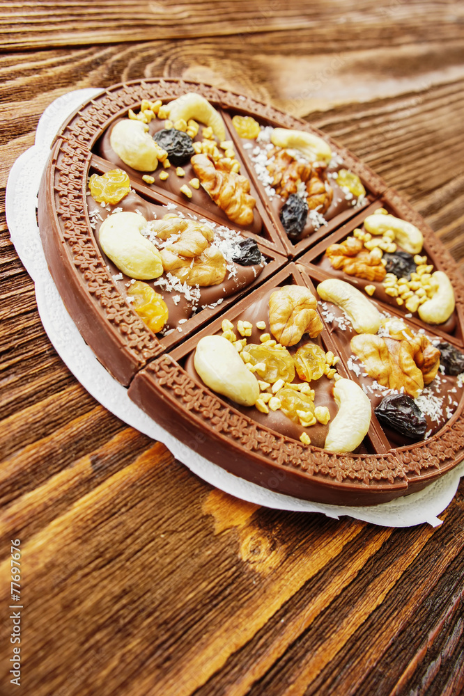 Dessert chocolate pizza with raisins and nuts Dessert chocolate pizza with raisins and nuts