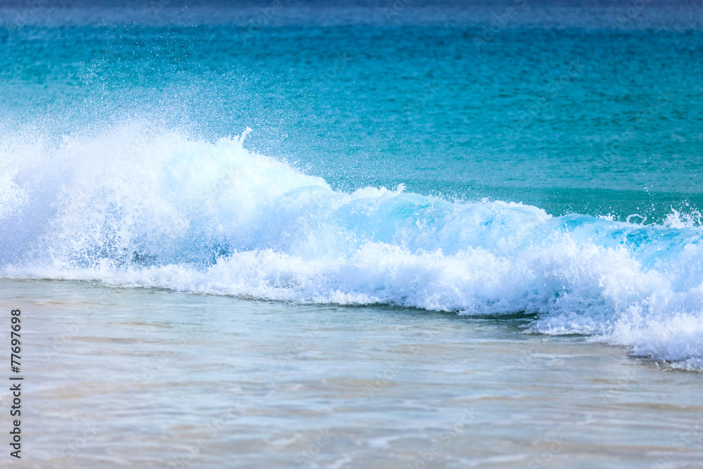 Wave of the sea on the sand beach