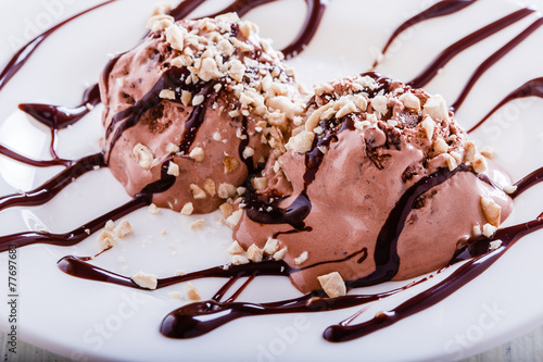 Chocolate ice cream with cashews and chocolate syrup