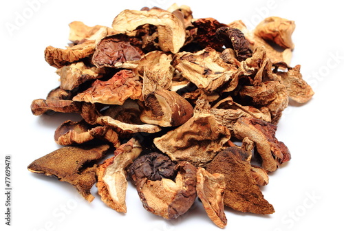 Heap of dried mushrooms on white background