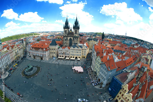 Houses with traditional red roofs in Prague Old Town Square in t