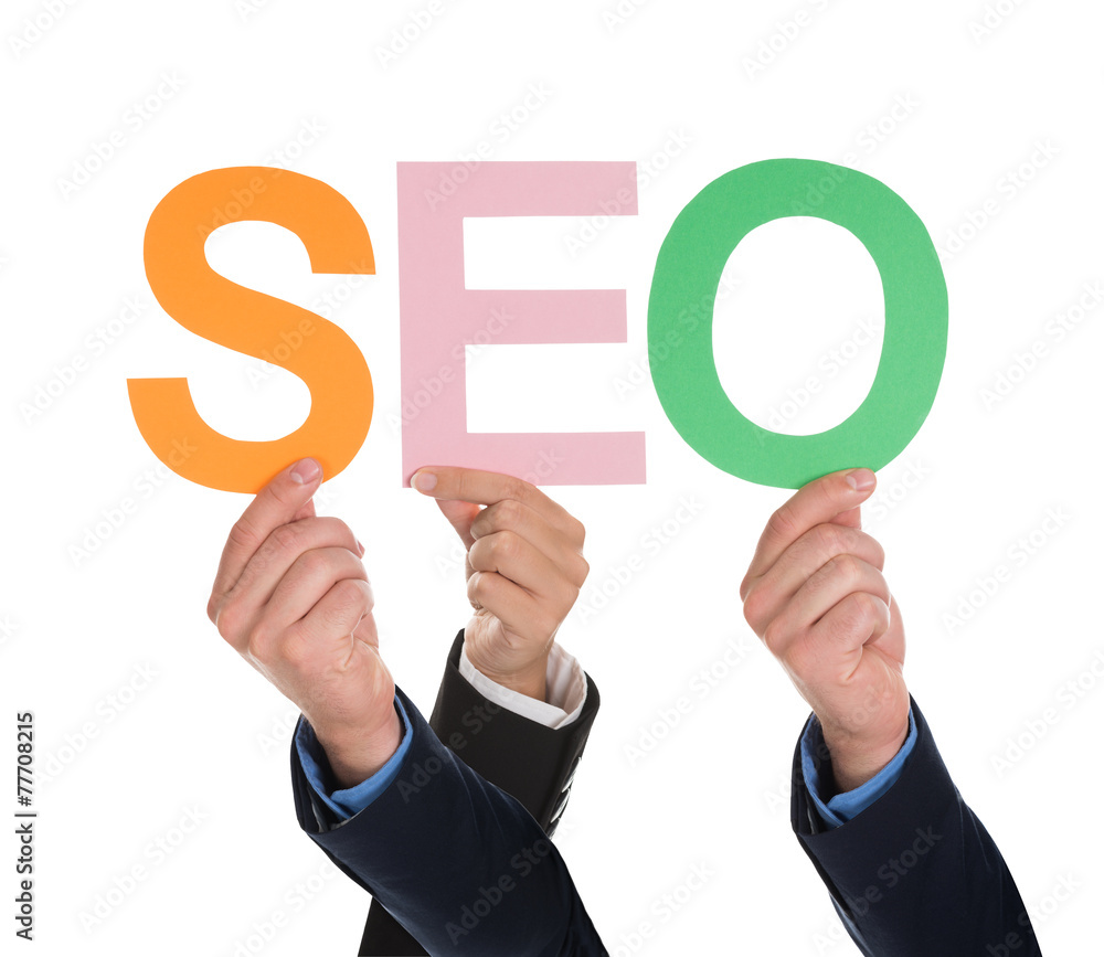 Multiple Hands Holding SEO Word Multiple Hands Holding SEO Word