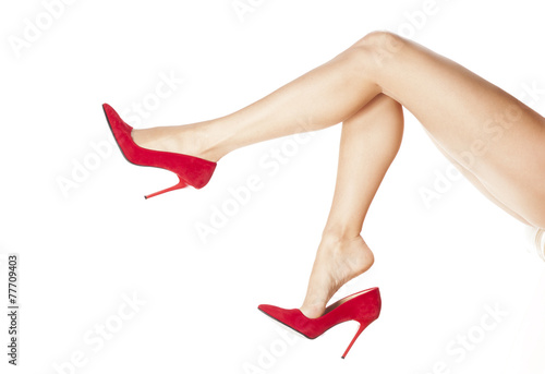 Fotografia pretty female legs in red high heels
