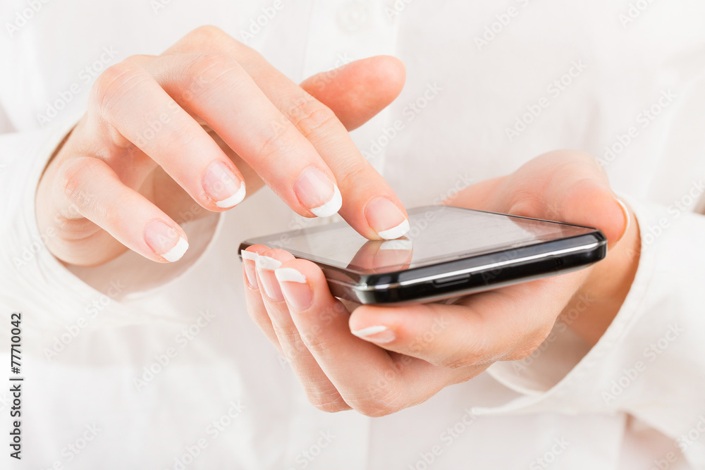 Business woman with young hands and beautiful nails using mobile Business woman with young hands and beautiful nails using mobile