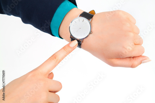 Fototapeta Naklejka Na Ścianę i Meble -  business woman pointing her watch over white background
