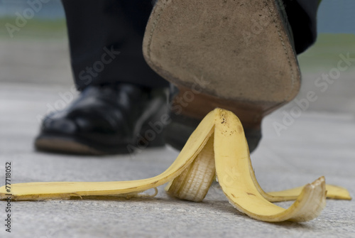 Businessman and banana skin photo