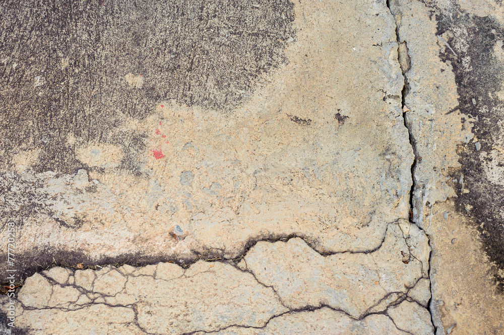 Obraz premium The old grey concrete wall crack background