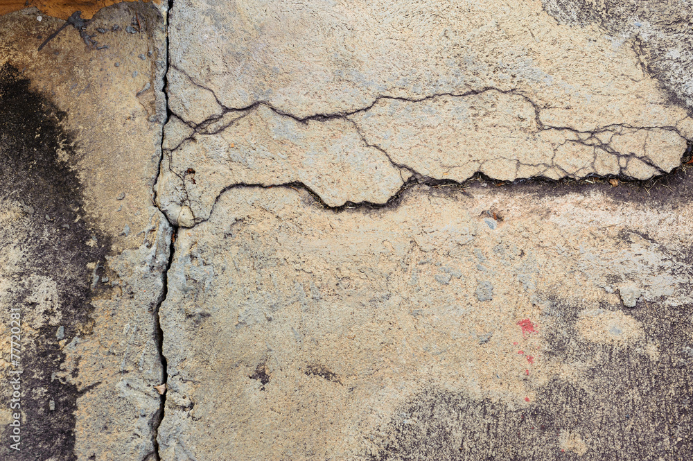 The old grey concrete wall crack background The old grey concrete wall crack background
