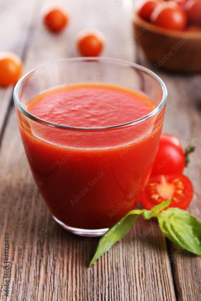 Tomato juice in glass with basil and tomatoes cherry Tomato juice in glass with basil and tomatoes cherry