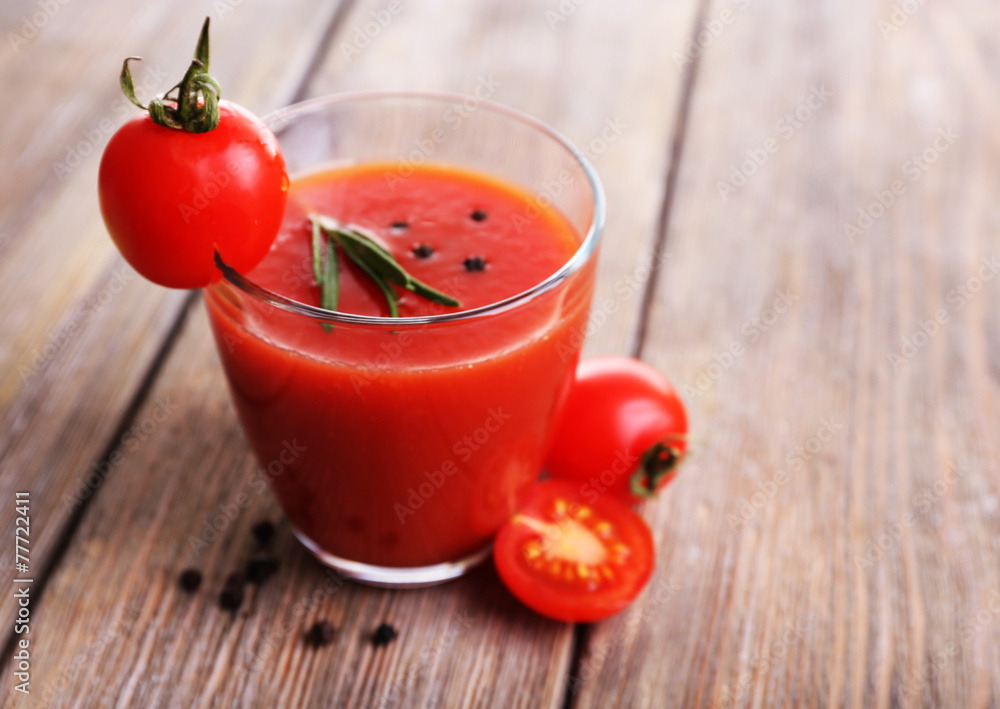Tomato juice in glass with pepper and rosemary Tomato juice in glass with pepper and rosemary