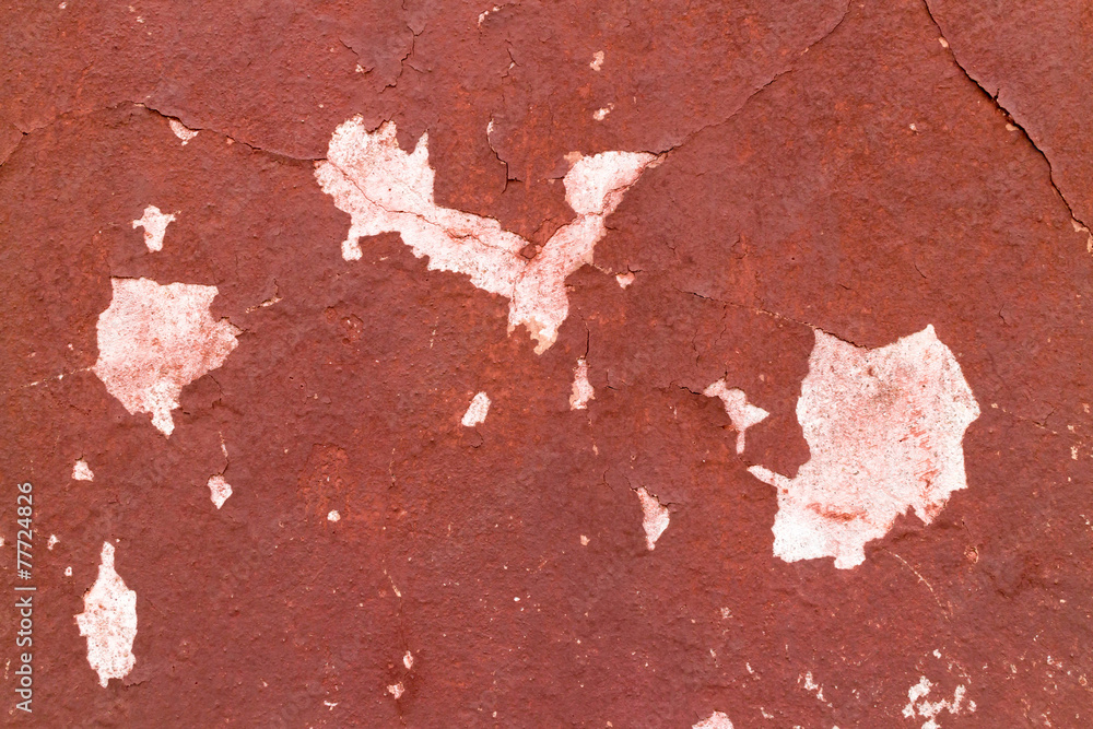 Fototapeta premium Crack red painted wall texture background.