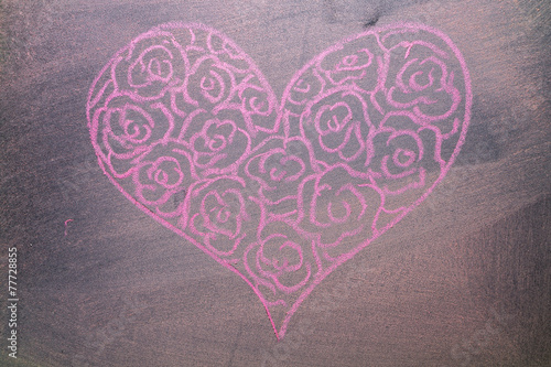 Hand drawn pink hearts on chalkboard background.